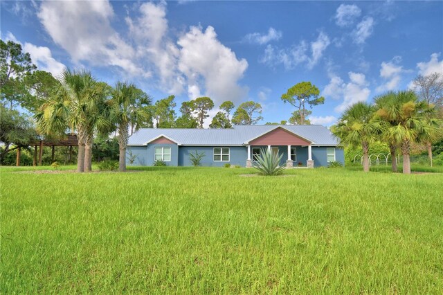 112 Reedy Creek Dr, Frostproof, FL 33843 - ranch-style house with a metal roof