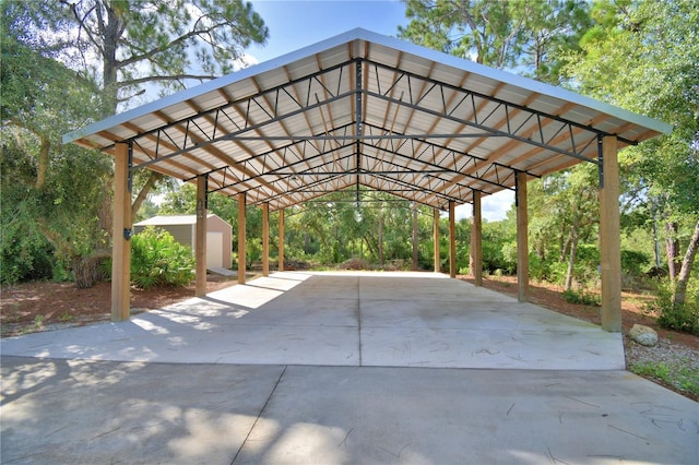 112 Reedy Creek Dr, Frostproof, FL 33843 - view of car parking featuring a detached carport, a storage shed, and driveway
