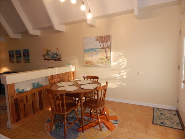 dining room featuring wood-type flooring and beam ceiling