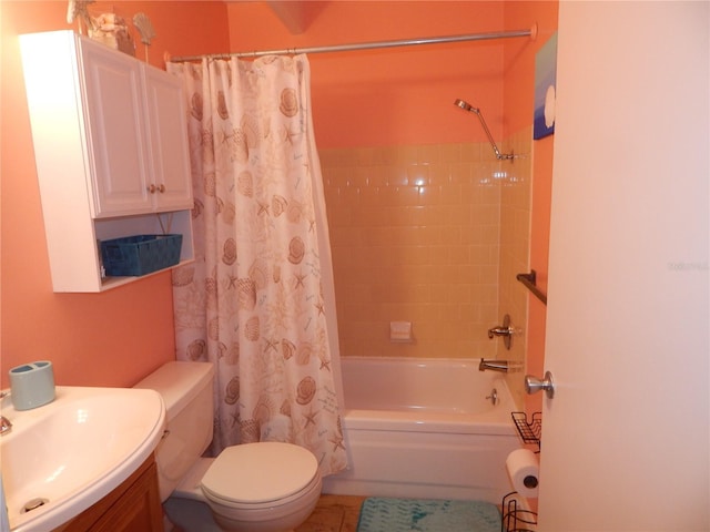 full bathroom featuring vanity, shower / bath combination with curtain, tile patterned floors, and toilet