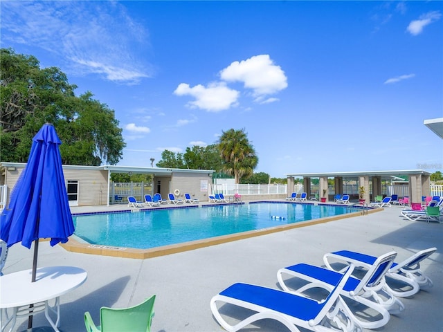 view of swimming pool with a patio area