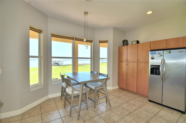 dining room featuring light tile patterned floors, recessed lighting, and baseboards