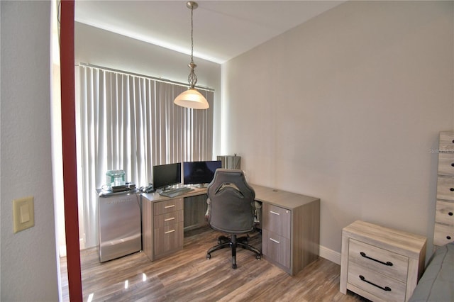 office space with wood finished floors