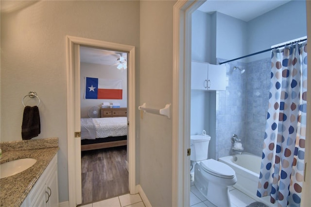 full bathroom featuring toilet, shower / bath combination with curtain, vanity, and tile patterned flooring