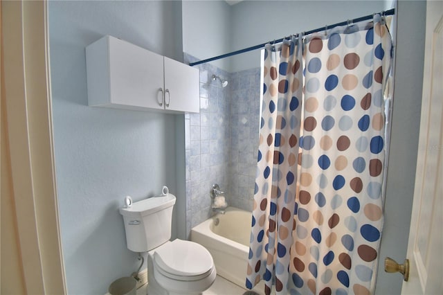 bathroom with toilet and shower / bath combo with shower curtain