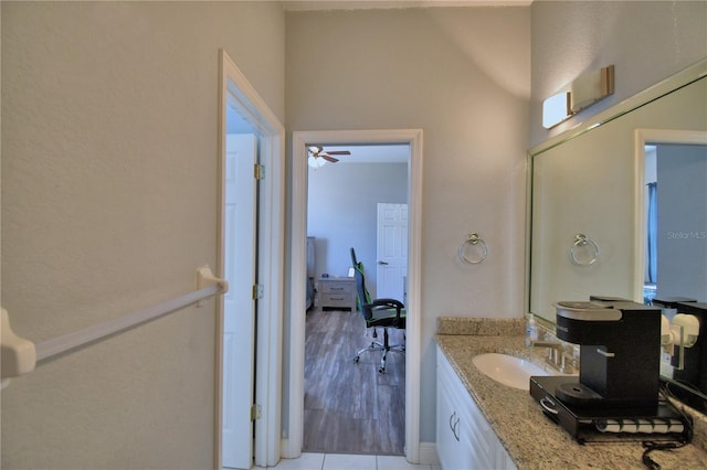 bathroom with vanity and wood finished floors