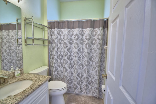 bathroom with toilet and vanity