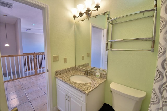 bathroom featuring visible vents, toilet, a notable chandelier, tile patterned flooring, and vanity