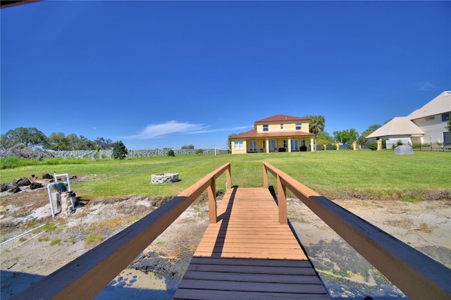 dock area featuring a lawn