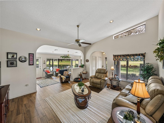 living room with hardwood / wood-style floors, a textured ceiling, and a wealth of natural light