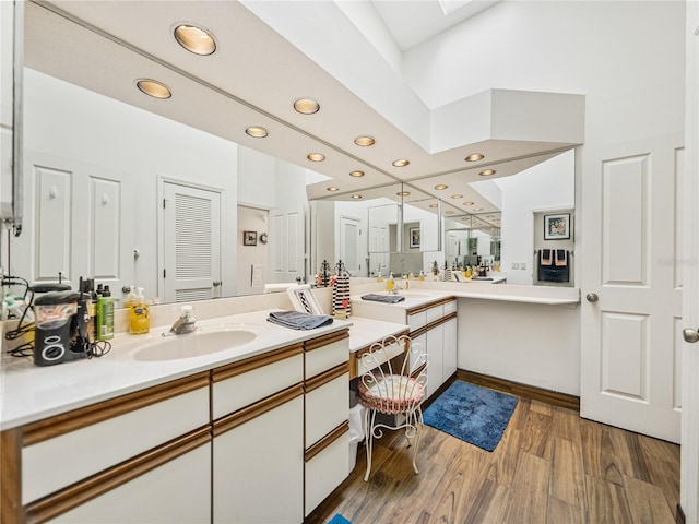 bathroom with vanity and hardwood / wood-style flooring