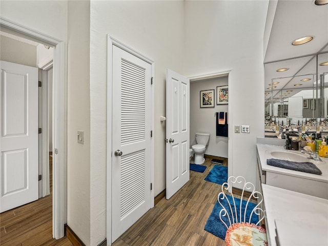 hallway with sink and dark hardwood / wood-style flooring