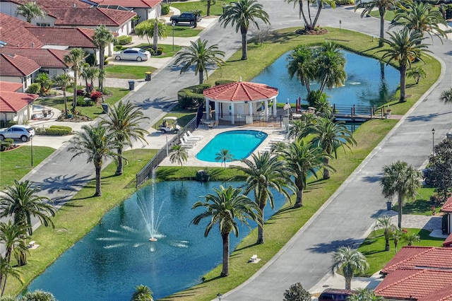 view of swimming pool featuring a gazebo and a water view