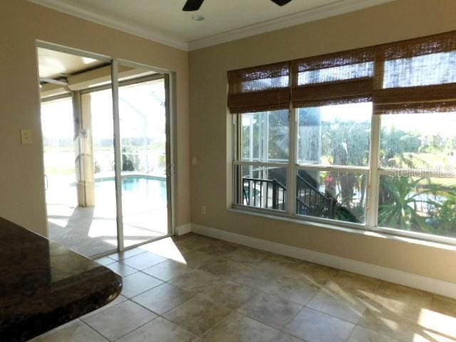 interior space featuring crown molding and ceiling fan