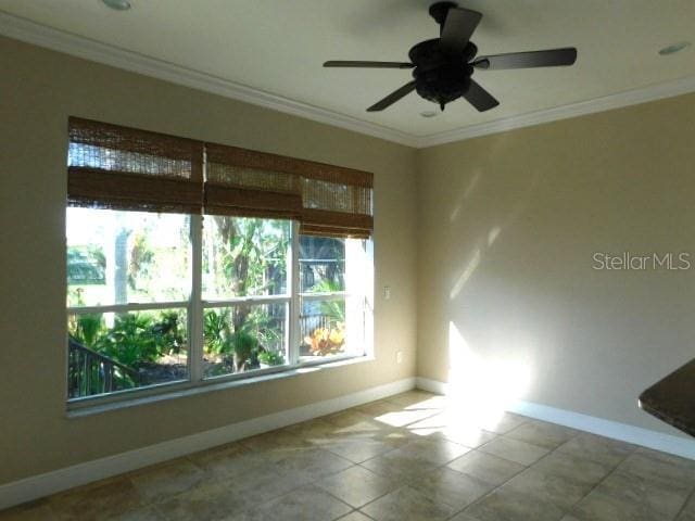 empty room with crown molding and ceiling fan