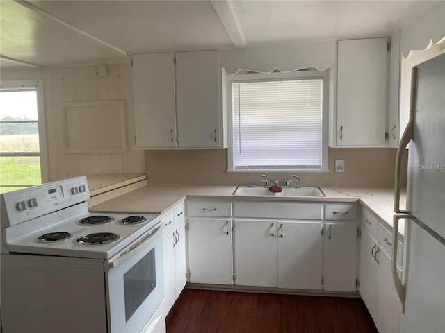 kitchen with white appliances and white cabinets