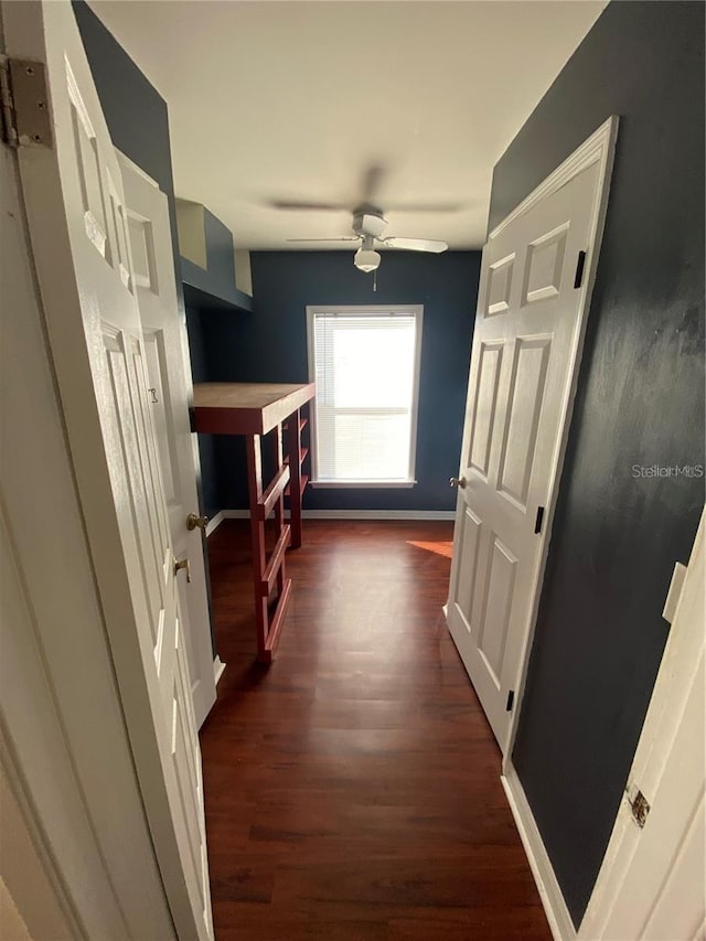 corridor featuring dark wood-type flooring