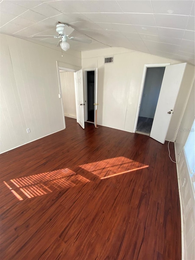 unfurnished room featuring ceiling fan and dark hardwood / wood-style flooring