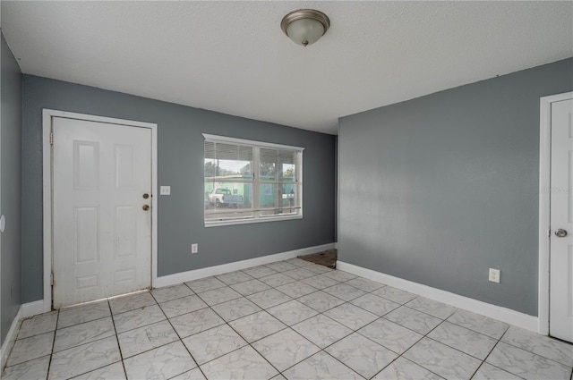 entrance foyer with a textured ceiling