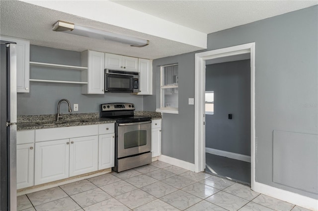 kitchen with a sink, appliances with stainless steel finishes, marble finish floor, white cabinetry, and open shelves