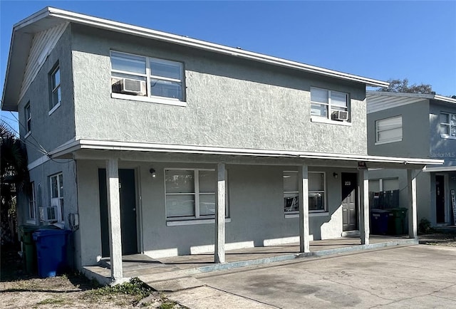 front facade with cooling unit and covered porch