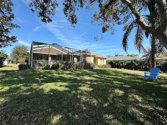 view of yard with a lanai