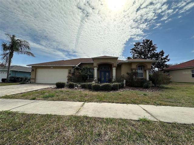 ranch-style house with french doors, driveway, an attached garage, and stucco siding