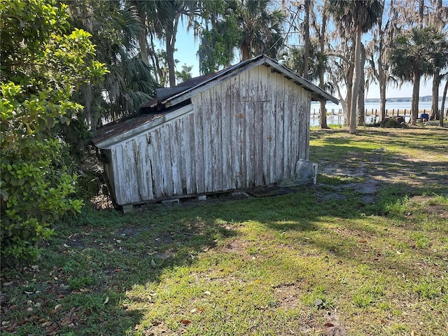 view of outdoor structure featuring a water view and an outdoor structure