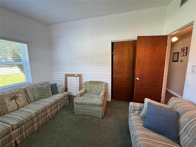 carpeted living area featuring visible vents