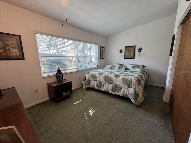 carpeted bedroom featuring baseboards and vaulted ceiling