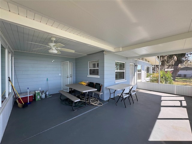 view of patio with outdoor dining area and ceiling fan