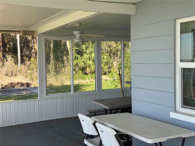 sunroom with a healthy amount of sunlight and a ceiling fan