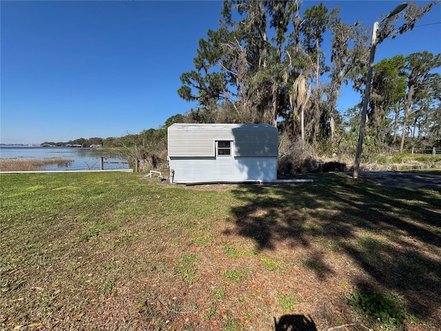 view of shed with a water view