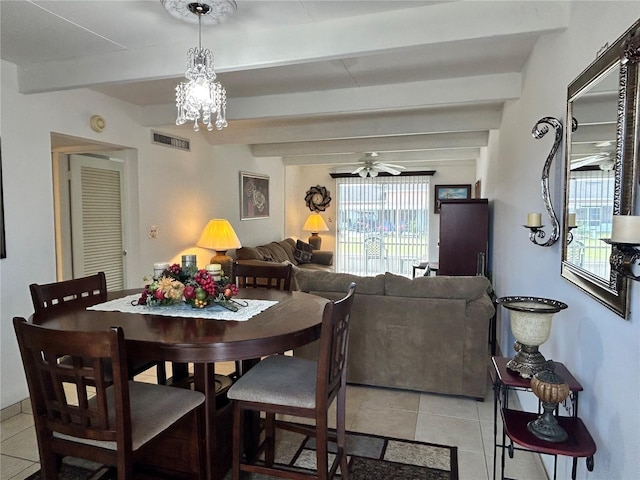 dining room with ceiling fan with notable chandelier, beam ceiling, visible vents, and light tile patterned floors