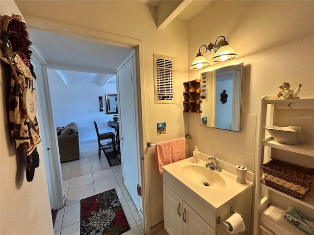 bathroom with tile patterned flooring and vanity