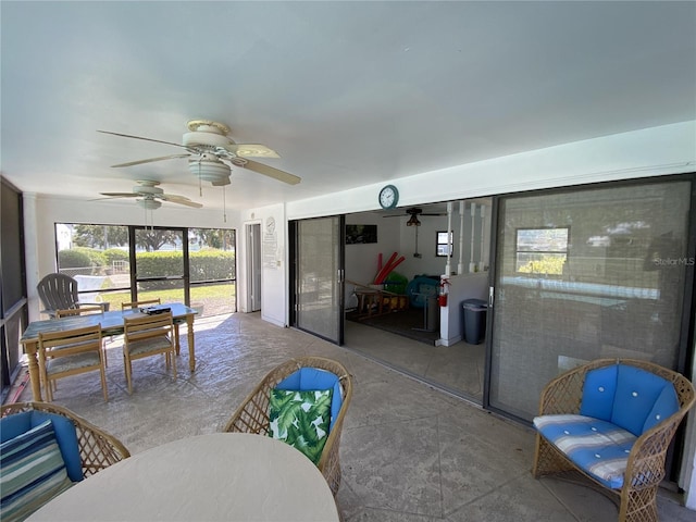 sunroom / solarium with ceiling fan