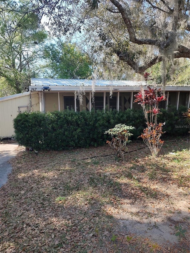 view of front of property with metal roof