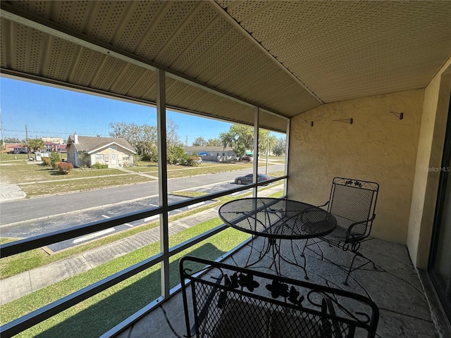 sunroom / solarium with lofted ceiling