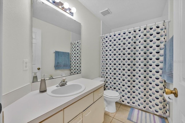 full bathroom with toilet, a shower with shower curtain, vanity, visible vents, and tile patterned floors