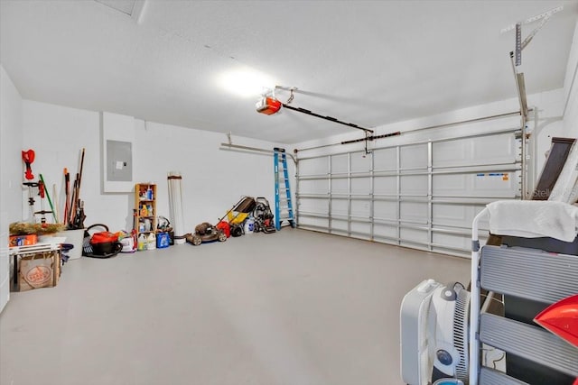 garage featuring electric panel and a garage door opener