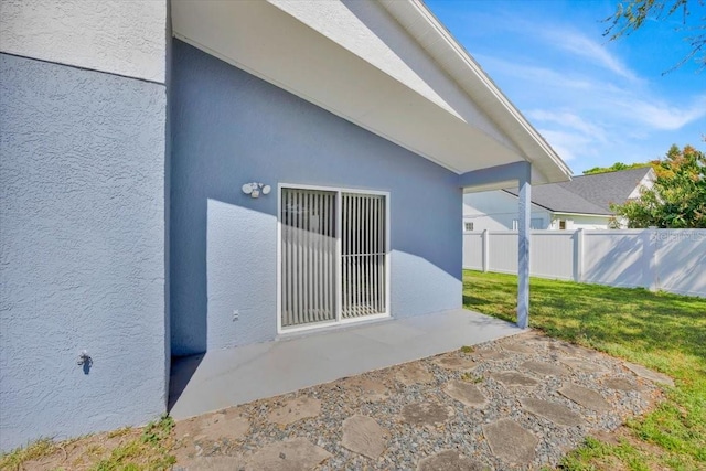 view of patio / terrace featuring fence