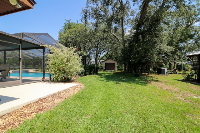3567 Red Oak Ct, Lake Wales, FL 33898 - view of green lawn with a patio, an outdoor pool, central air condition unit, and glass enclosure