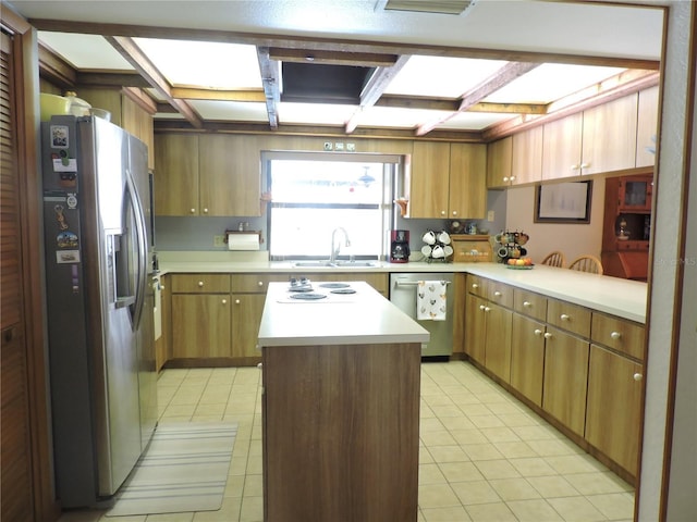 3567 Red Oak Ct, Lake Wales, FL 33898 - kitchen with appliances with stainless steel finishes, a sink, light countertops, coffered ceiling, and beamed ceiling