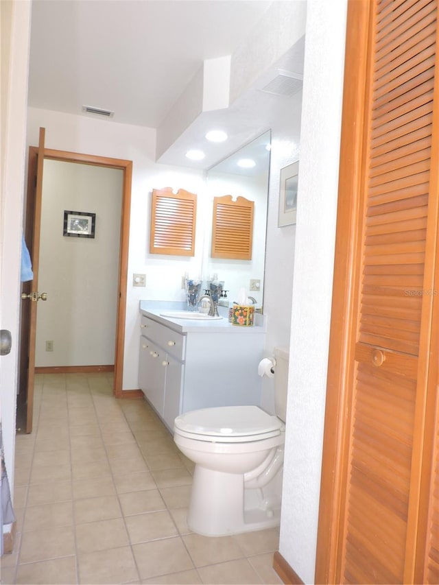 3567 Red Oak Ct, Lake Wales, FL 33898 - bathroom with vanity, toilet, and tile patterned floors