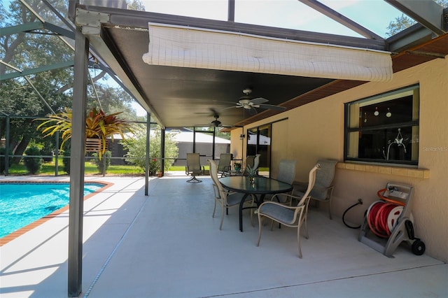 3567 Red Oak Ct, Lake Wales, FL 33898 - view of patio featuring a ceiling fan, glass enclosure, an outdoor pool, and outdoor dining area