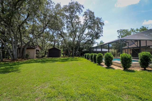 3567 Red Oak Ct, Lake Wales, FL 33898 - view of grassy yard with an outdoor pool and glass enclosure