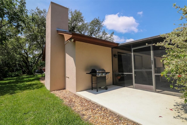 3567 Red Oak Ct, Lake Wales, FL 33898 - back of property featuring a yard, stucco siding, and a patio area