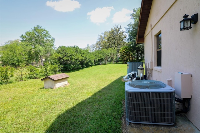 3567 Red Oak Ct, Lake Wales, FL 33898 - view of grassy yard with cooling unit and view of scattered trees