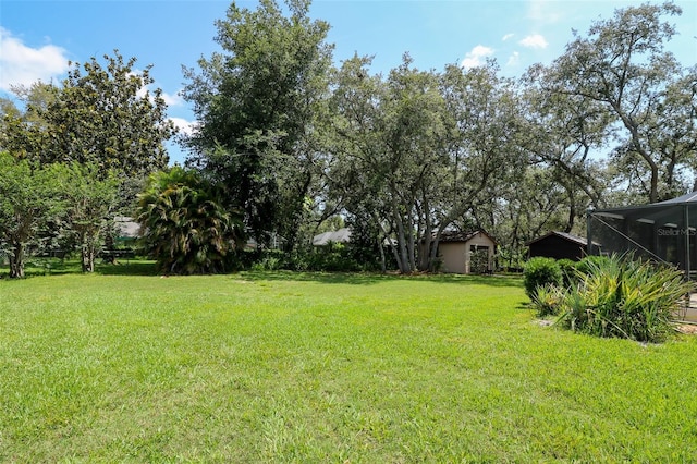 3567 Red Oak Ct, Lake Wales, FL 33898 - view of green lawn with glass enclosure