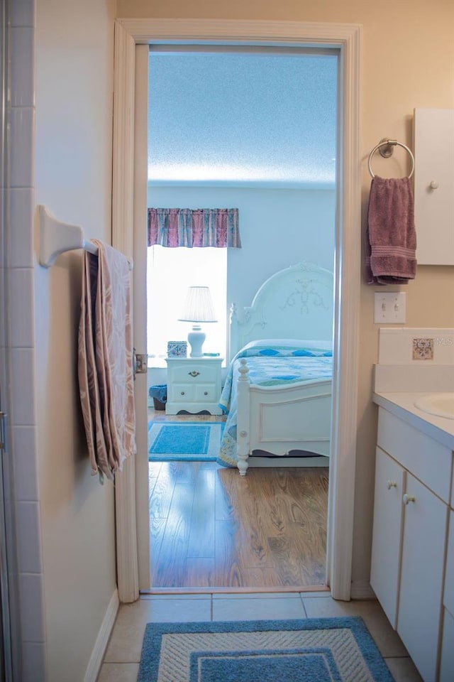 bathroom featuring vanity and wood finished floors